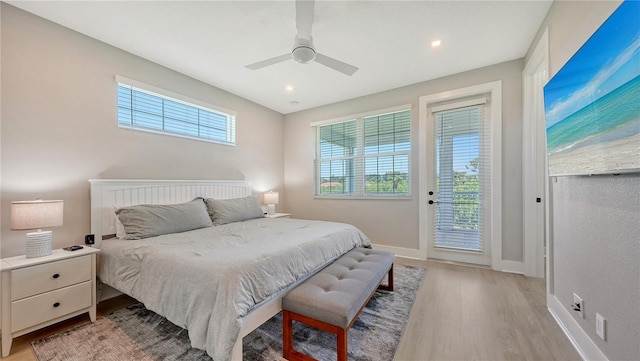 bedroom with access to outside, ceiling fan, and light hardwood / wood-style floors