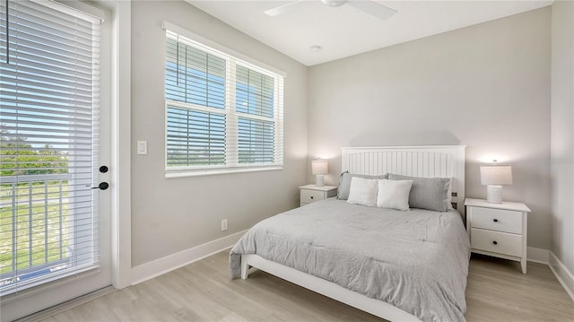 bedroom with light hardwood / wood-style floors, multiple windows, and ceiling fan