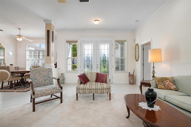 5249 Far Oak Cir, Sarasota, FL 34238 - living room featuring french doors, a ceiling fan, light tile patterned flooring, ornamental molding, and light colored carpet