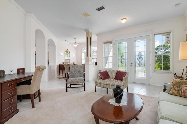 carpeted living room featuring french doors, ceiling fan, and ornamental molding