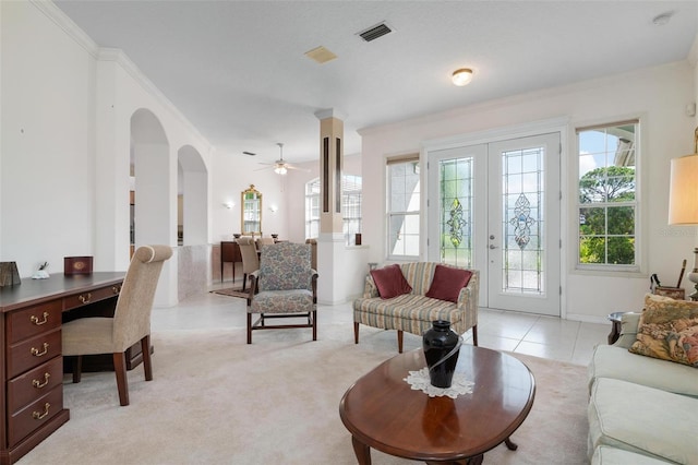 5249 Far Oak Cir, Sarasota, FL 34238 - living room featuring arched walkways, ornamental molding, ceiling fan, an office area, and light tile patterned floors