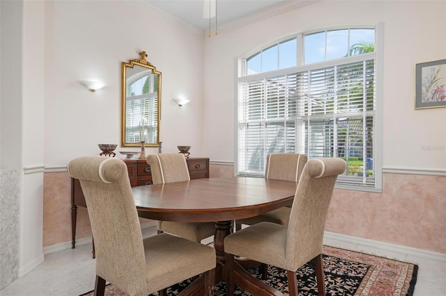 tiled dining area with crown molding