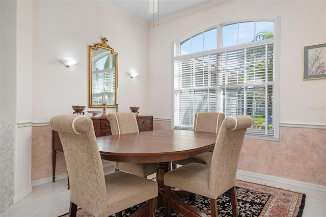 5249 Far Oak Cir, Sarasota, FL 34238 - dining room with ornamental molding, wainscoting, light tile patterned floors, and baseboards