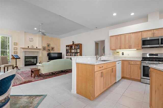 5249 Far Oak Cir, Sarasota, FL 34238 - kitchen featuring appliances with stainless steel finishes, a peninsula, a sink, ceiling fan, and open floor plan