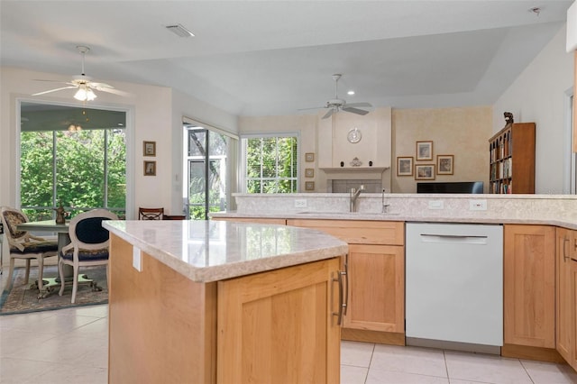 5249 Far Oak Cir, Sarasota, FL 34238 - kitchen with a ceiling fan, white dishwasher, a sink, and light tile patterned floors