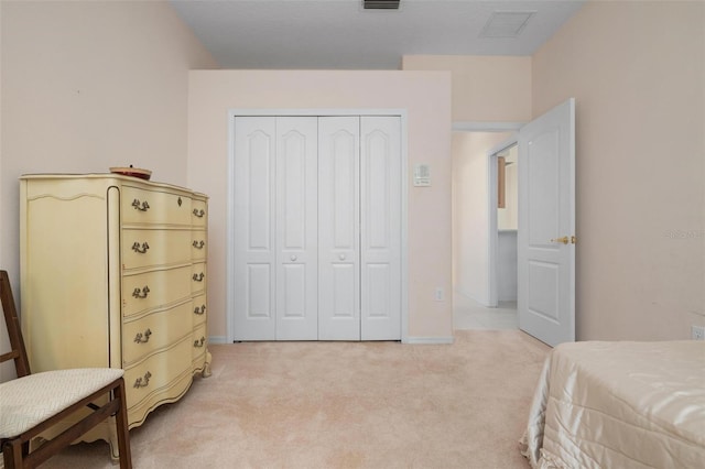 carpeted bedroom with a closet