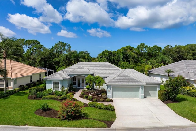 5249 Far Oak Cir, Sarasota, FL 34238 - ranch-style home featuring a garage, driveway, a front lawn, and a tile roof