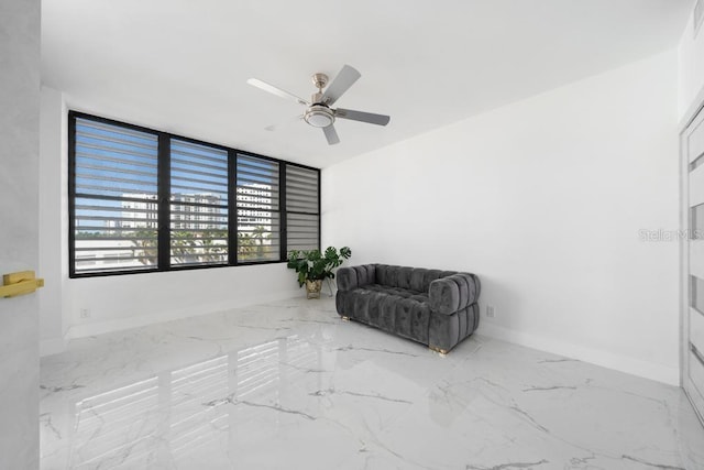 living area featuring ceiling fan