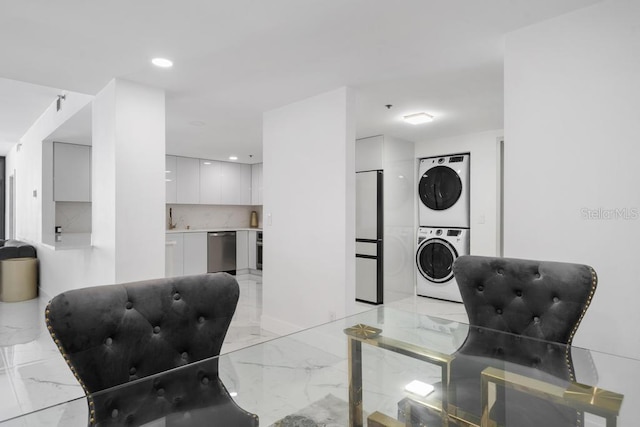 living room featuring stacked washer and dryer