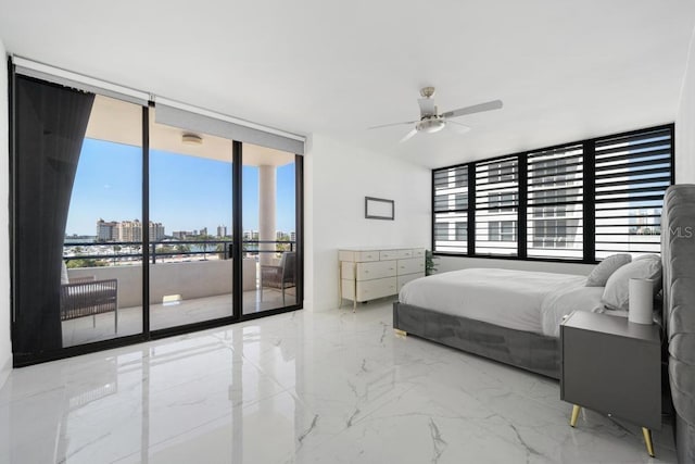 bedroom with ceiling fan, access to outside, and a wall of windows