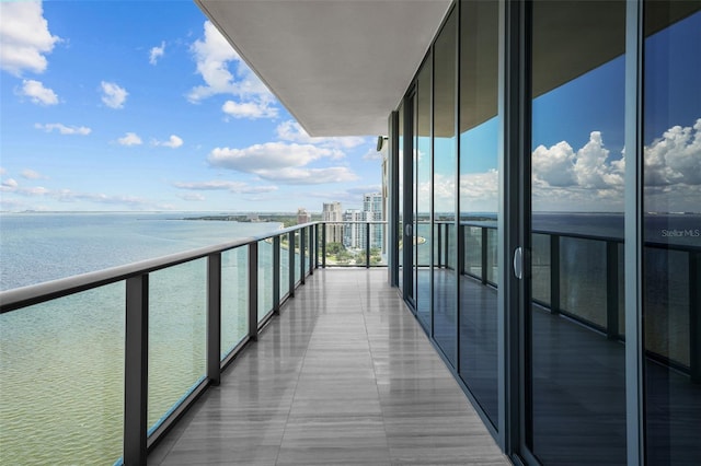 balcony featuring a water view