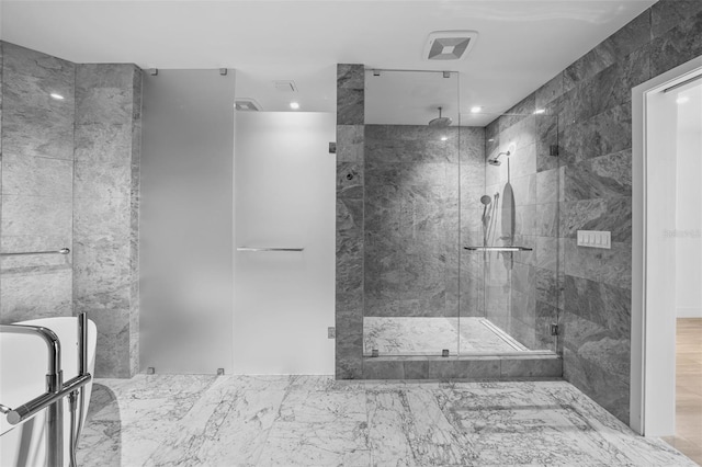 bathroom with a shower with shower door