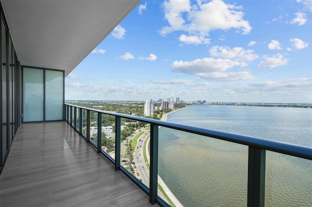 balcony featuring a water view