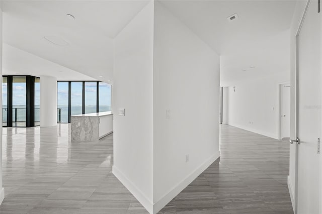 hallway featuring expansive windows