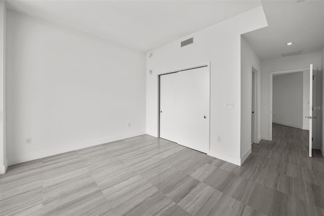 unfurnished bedroom with a closet