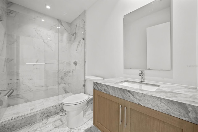 bathroom with vanity, an enclosed shower, and toilet