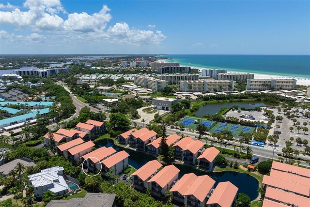 birds eye view of property featuring a water view