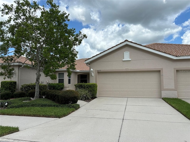 single story home featuring a garage