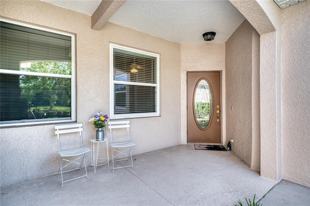 doorway to property with a patio