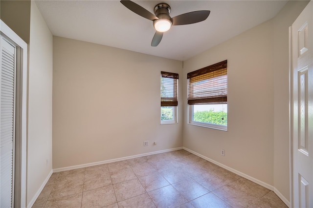 unfurnished bedroom with light tile patterned floors and ceiling fan