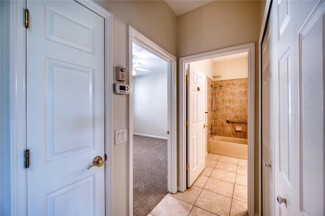 corridor with light colored carpet