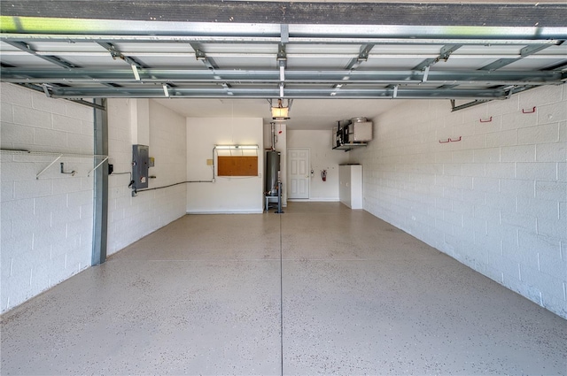 garage with a garage door opener, electric panel, and water heater