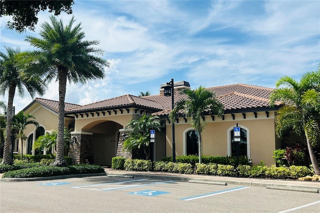 view of property featuring uncovered parking