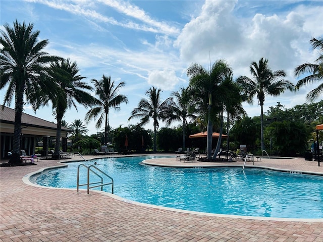 community pool with a patio area