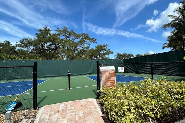 view of sport court with fence