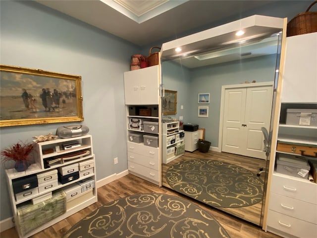 home office with baseboards and dark wood-style flooring