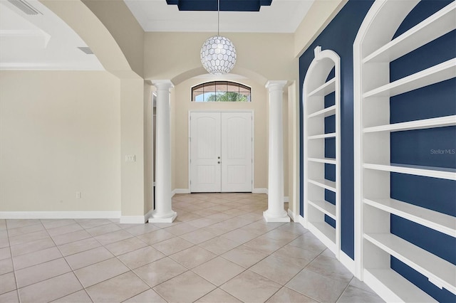 tiled entrance foyer featuring ornate columns