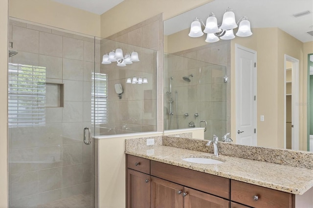 bathroom with vanity and an enclosed shower