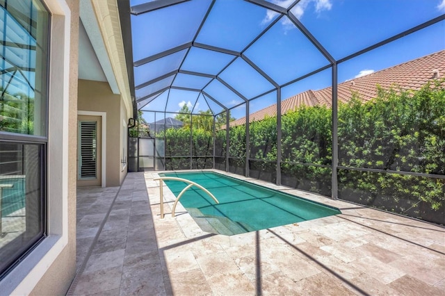 view of pool featuring a lanai and a patio area