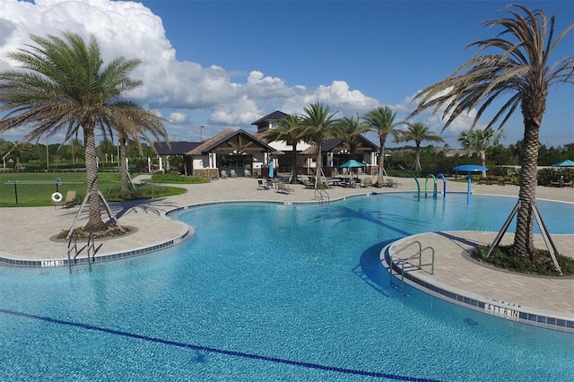 view of swimming pool with a gazebo and a patio area