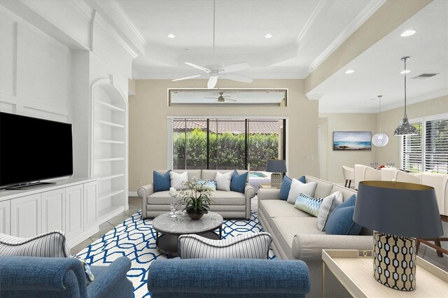 living room with crown molding and ceiling fan