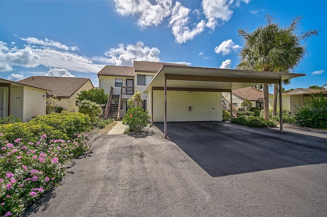 view of front of home with a carport