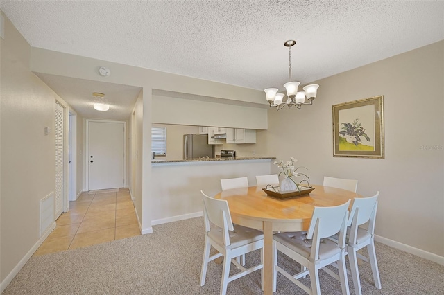 carpeted dining space featuring a textured ceiling and a notable chandelier