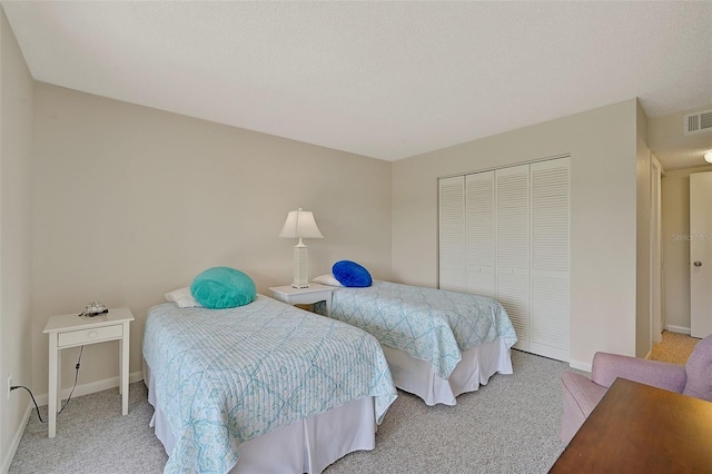 carpeted bedroom with a closet