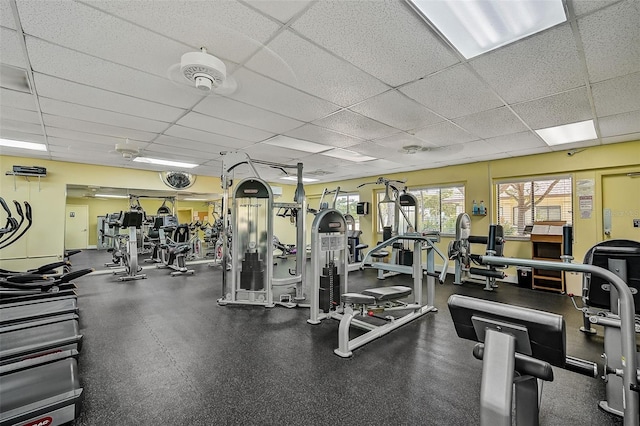 workout area featuring a drop ceiling