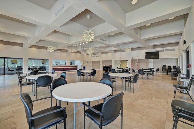 dining room featuring beam ceiling, coffered ceiling, and ceiling fan