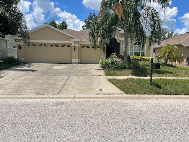 view of front of home with a garage