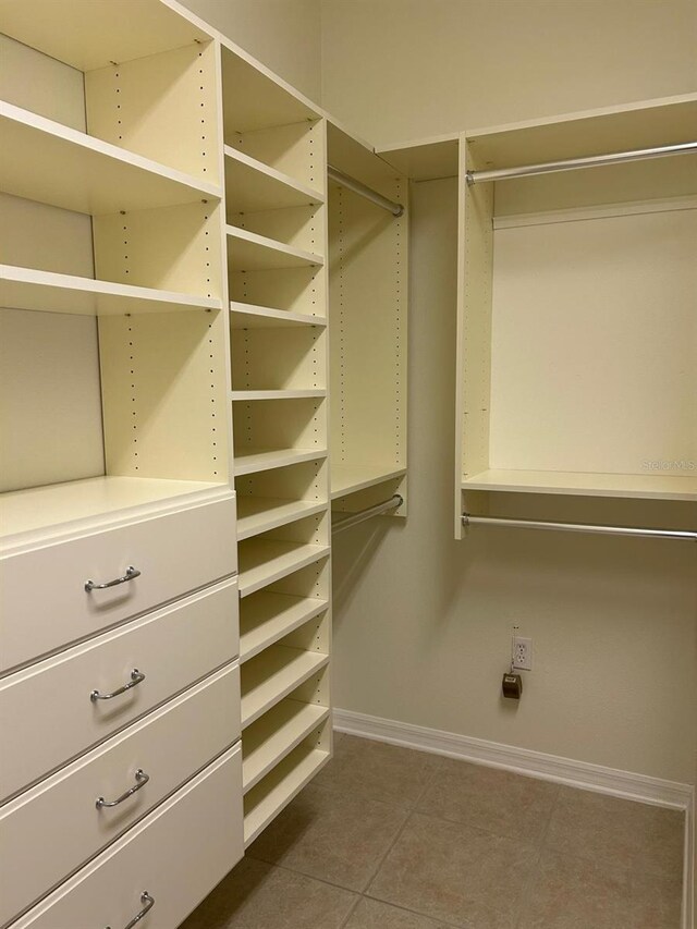 spacious closet featuring tile patterned floors