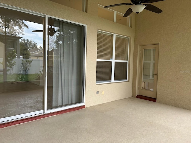 view of patio featuring ceiling fan