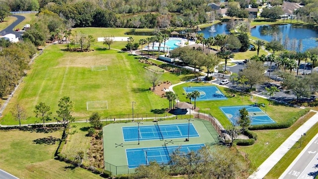 birds eye view of property with a water view