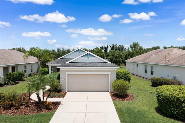 ranch-style home with a front yard and a garage