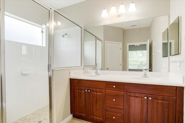 bathroom featuring vanity and an enclosed shower