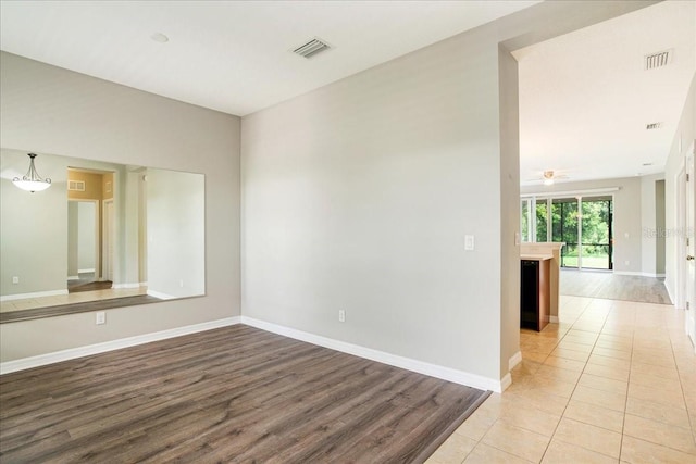 unfurnished room featuring light tile patterned floors