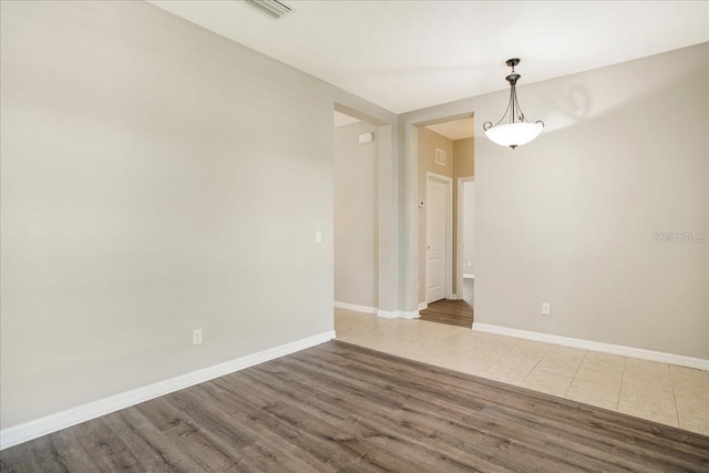 empty room featuring dark wood-type flooring