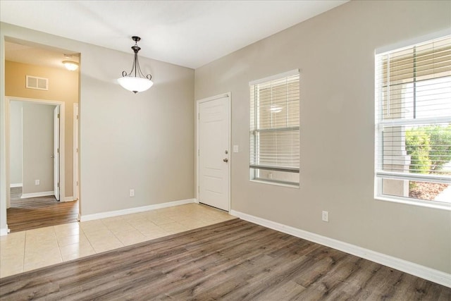 spare room with light wood-type flooring