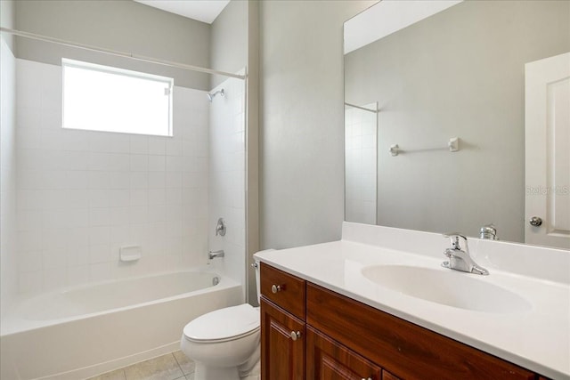 full bathroom with toilet, vanity, tile patterned floors, and shower / washtub combination